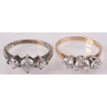 Two cubic zirconia rings, one set in 14ct gold, the other silver.
