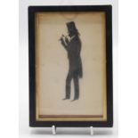 A framed silhouette of a gentleman, paper label to reverse inscribed 'H.W.