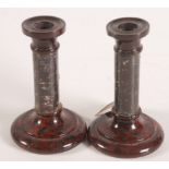 A pair of Cornish serpentine candlesticks, height 14.5cm.