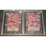 A pair of Chinese red silk panels embroidered in blue,