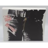 The Rolling Stones Sticky Fingers boxed three CD, vinyl, book set.