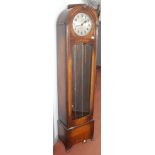 A pre war oak clock, the circular silvered dial signed Charles E Green Ltd, Leicester, height 187cm.