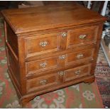 An early 18th century joined oak chest, fitted three long drawers,