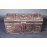 A leather covered, domed top trunk with tooled geometric decoration, height 41cm, width 80cm,