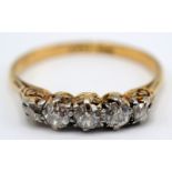 An 18ct gold ring set five diamonds. Condition report: 2.