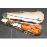 A cased violin and bow, length of back 34cm.