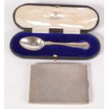 A silver spoon, cased, and a silver cigarette case. 6oz.