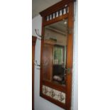A late Victorian hall mirror with oak frame,