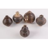 Khmer ceramics, five 12th-13th century brown glaze pots, heights 12cm, 11cm, 11cm, 10cm and 9.