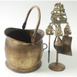A brass coal bucket, height 26cm and a fireside companion set, height 46cm, early 20th century.