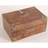 A burr walnut work box, 19th century, brass mounted with a shaped handle, height 11.5cm, width 25cm.