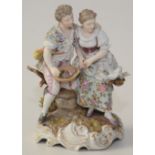 A continental porcelain group of a courting couple,