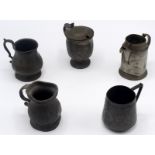 Five small pewter jugs and measures.