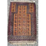 A Belouch prayer rug, the camel mihrab with guls, within multiple borders, 138 x 83cm.