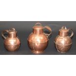 Three Jersey copper graduated jugs and covers, early 20th century,