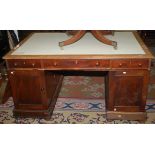 A 19th century mahogany partners desk with twin pedestals, one side fitted drawers,