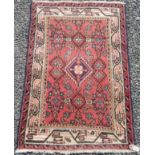 A Sereband rug, north west Persia, the madder field with a central indigo medallion,
