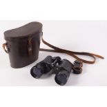 A pair of leather cased Skybolt Empire Made binoculars, hard coated lenses 7x50, height 18cm.