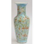 A large Persian pottery baluster vase, 19th century, the cartouche filled with Islamic script,