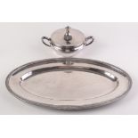 A German Gebruder Hepp circular twin handled lidded dish with the initials of Peter Fassbender,