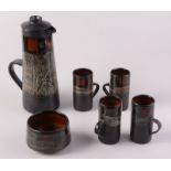 A Celtic Pottery, Newlyn 'Medallion' pattern coffee set, comprising a coffee pot,