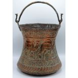 A Middle Eastern copper pail, with a brass bail handle,