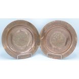 Two Islamic copper circular plates, diameter 27cm.