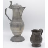 A continental pewter lidded jug, 35.5cm and a pewter pint mug, inscribed and dated 1868, height 12.