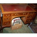 An Edwardian mahogany knee hole desk by Waring & Gillow with inlaid bands,