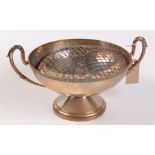 A silver rose bowl with twin cast handles and cast border, London 1925, diameter 25.