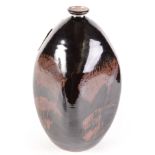 A large stoneware tenmoku glaze vase with slender neck, abstract decoration, height 38cm.