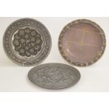 A Persian white metal circular plaque 29.5cm and two others.