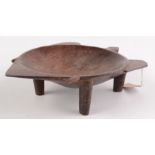 A Fijian carved hardwood kava bowl of turtle shaped outline, raised on four peg feet, length 35cm,