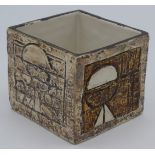A Troika cube vase decorated by Mary Baker, with brown and white abstract designs, height 8cm.