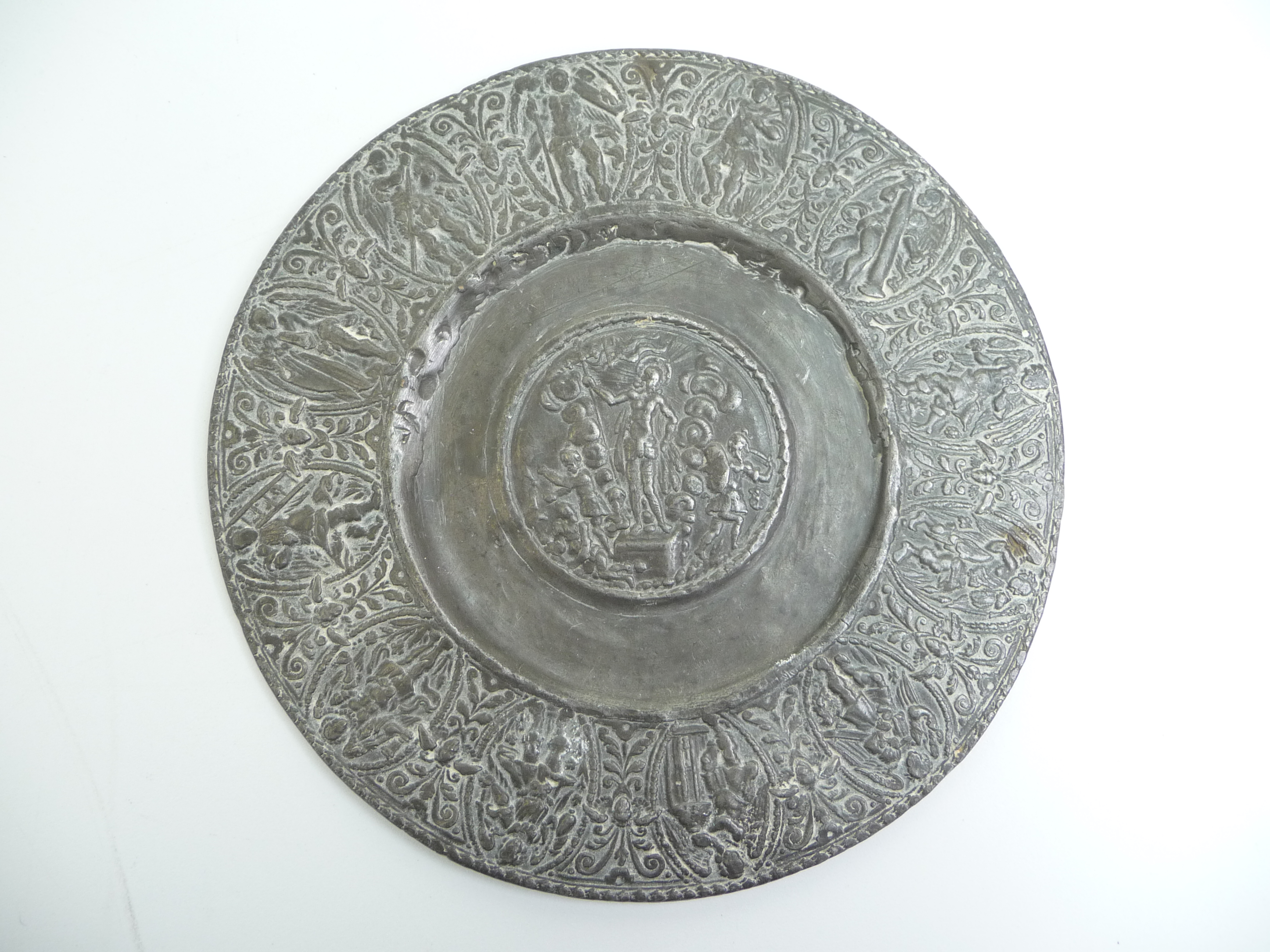 A pewter dish in 17th century style, to the centre Christ holds a flag and cross, - Image 3 of 5