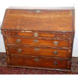 A George III oak slope front bureau.