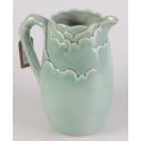 A Clarice Cliff Newport Pottery pale green leaf moulded jug, height 24cm.