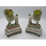 A pair of Victorian Staffordshire porcelain poodles,