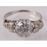 A good diamond ring with central brilliant cut diamond of approximately 1.