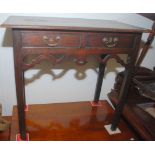 An oak two drawer lowboy with pierced apron.