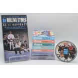 The Rolling Stones, a set of four Stones Shape picture CDs,
