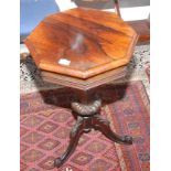 A Victorian rosewood veneered octagonal tapering sewing table, on a tripod base.