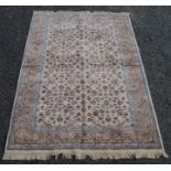 A rug, the ivory field with an all over design of scrolling vines and leaves,