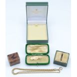 A Victorian gold brooch, a 9ct gold rope necklace and four boxes.