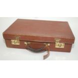 A leather briefcase by saddlers W & H Gidden, London by Appointment to Her Majesty The Queen,