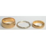 Two 18ct gold bands, 8.7g, and a 14ct white gold band, 1.9g.