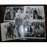 The Rolling Stones, a collection of mostly black and white photographs of the band etc.