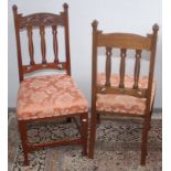 A set of six Art Nouveau carved walnut dining chairs.