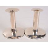 A pair of contemporary filled silver candlesticks, height 12cm.