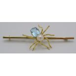 A 9ct gold spider bar brooch set a cultured pearl and blue stone.